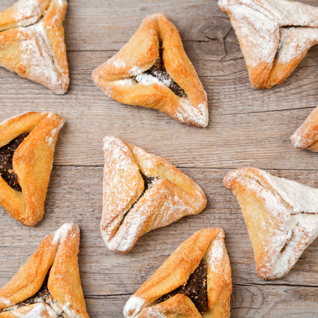 Hamantaschen cookies on wooden backgroundの写真素材