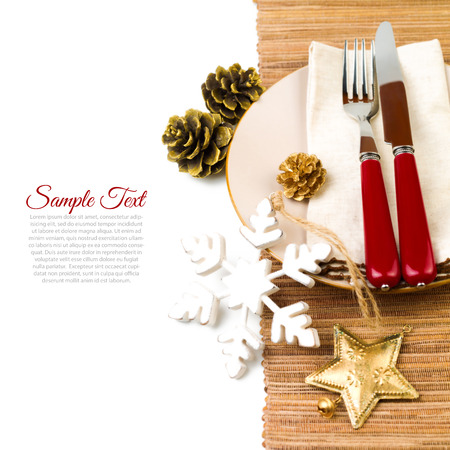 Christmas table setting with plate, kine, fork and decorationsの写真素材