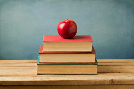 Back to school concept. Apple on vintage booksの写真素材