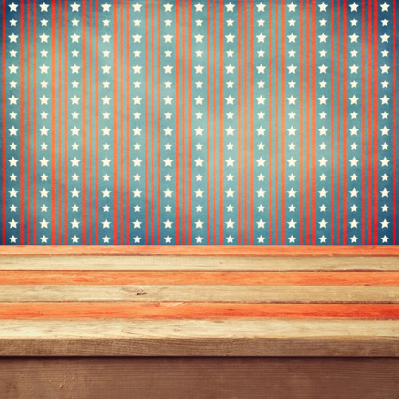 Empty wooden deck table over USA flag backgroundの写真素材