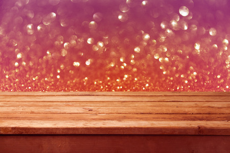 Bokeh background with empty wooden deck tableの写真素材