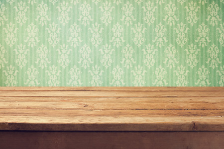 Vintage background with wooden deck table and classical wallpaperの写真素材