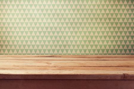 Vintage background with empty wooden table over wallpaperの写真素材