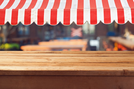 Empty wooden deck table with awing for product montage displayの写真素材