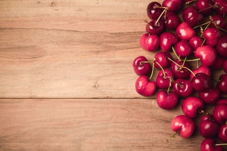 Food background with fresh cherries with retro filter effect. View from aboveの写真素材