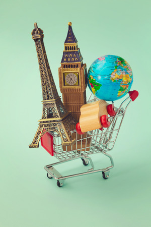 Shopping cart with souvenir from around the world. Retro filter effectの写真素材