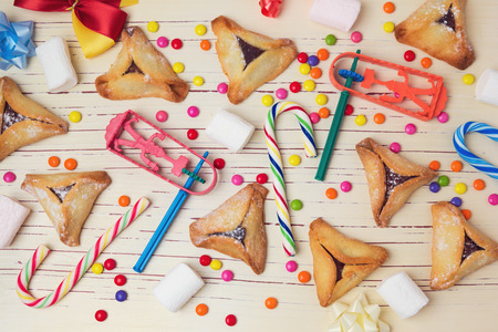 Hamantaschen cookies with candy. View from aboveの写真素材