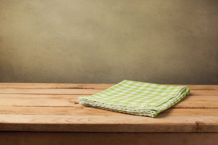 Empty wooden table with checked green tableclothの写真素材