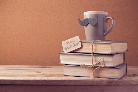 Cup of tea and old books for Father's Day celebrationの写真素材