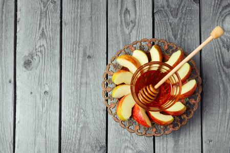 Plate with apple and honey for Jewish Holiday Rosh Hashana. View from above with copy spaceの写真素材