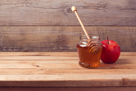 Autumn background with honey and appleの写真素材