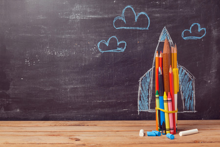 Back to school background with rocket made from pencils Back to school background with rocket made from pencils