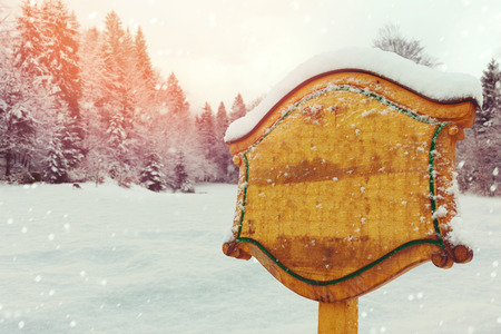 Wooden sign over winter nature landscapeの写真素材