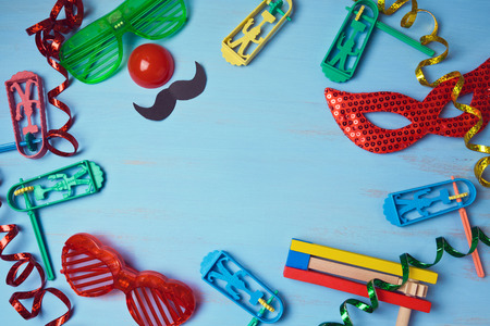 Jewish holiday purim background with carnival mask, party costume and noisemaker. View from aboveの写真素材