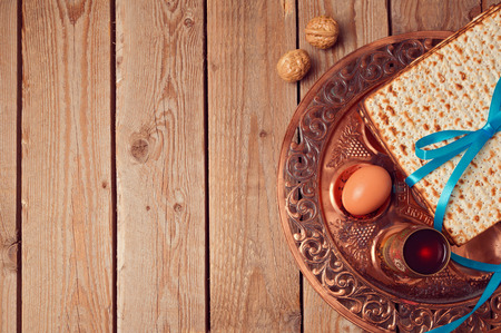 Passover background with matzo and vintage seder plate. View from above