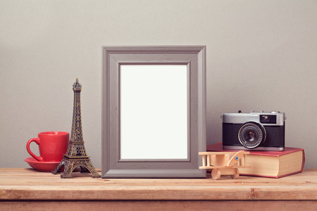Poster mock up template with Eiffel Tower and vintage film camera. Travel and tourism concept.の写真素材