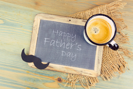 Father's day holiday background with chalkboard and coffee cup. View from aboveの写真素材