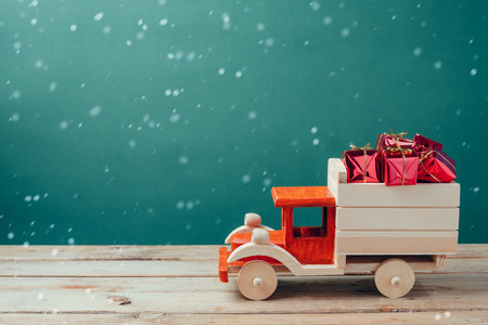 Christmas gift boxes in wooden toy truckの写真素材