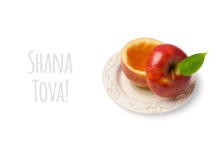 Apple with honey isolated on white background. Jewish New Year holiday Rosh Hashanah conceptの写真素材