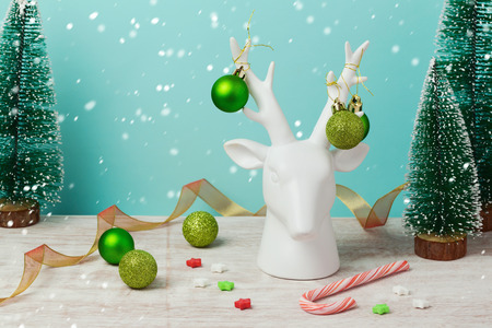 Christmas holiday decorations and ornaments with deer on wooden tableの写真素材