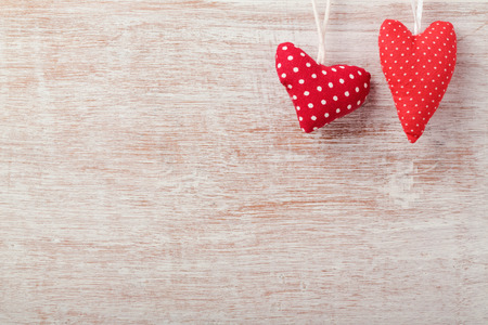 Valentine's day background with hearts over wooden rustic boardの写真素材
