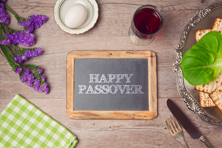 Happy Passover holiday greeting on chalkboard. View from aboveの写真素材
