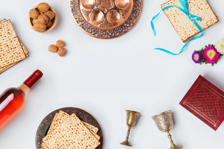 Jewish holiday Passover background with wine, matza and seder plate. View from above. Flat layの写真素材