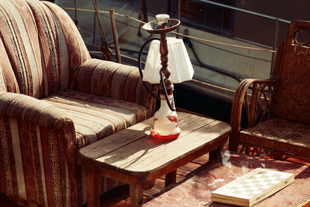 Vintage old chair and table on boat