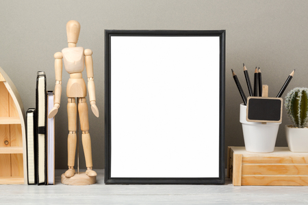 Modern workspace with blank frame mock up and office supplies. Creative desk interior background for socila media and marketingの写真素材