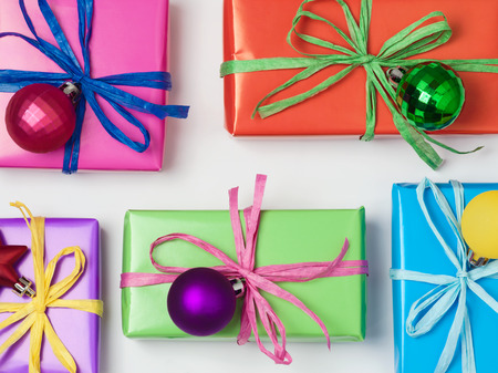 Christmas colorful gift boxes on white background. Christmas sale concept. View from above. Flat lay