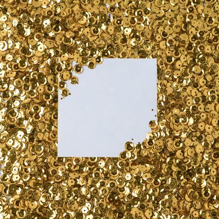 Gold glitter background with paper noteの写真素材