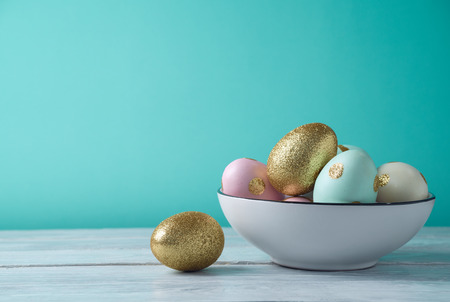 Easter holiday background with glitter golden eggs decorationの写真素材