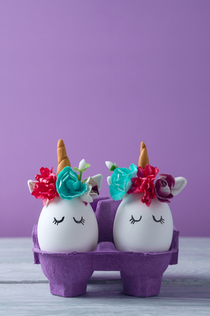 Easter holiday concept with cute handmade eggs, unicorns decorの写真素材