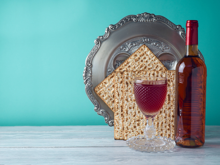 Passover holiday celebration concept with wine, matzo and seder plate.の写真素材