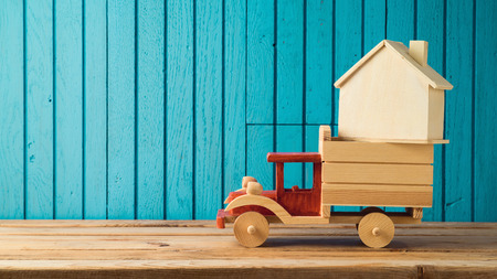 Moving to new house concept. House shape in toy truck.の写真素材