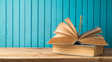 Old vintage books on wooden table. Back to school conceptの写真素材