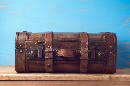 Vintage wooden suitcase on table backgroundの写真素材
