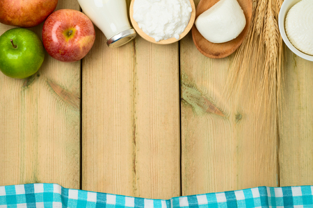 Milk and cheese, dairy products on wooden table background. Jewish holiday Shavuot concept. Top view from aboveの写真素材