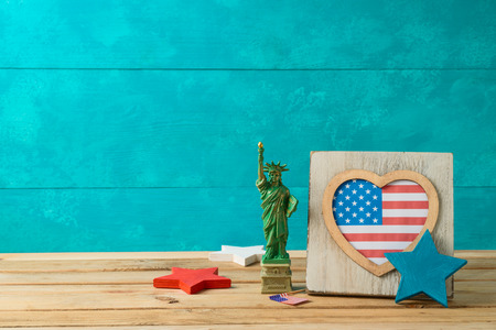 Happy Independence Day, 4th of July celebration concept with frame and american flag on wooden tableの写真素材