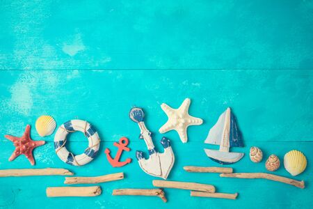 Summer background with nautical and marine decorations on wooden table. Top view from above