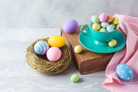 Easter holiday decorations with chocolate eggs and easter eggs decor on wooden table
