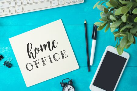 Home office and working from home concept. Table workplace with keyboard computer, notepad and...