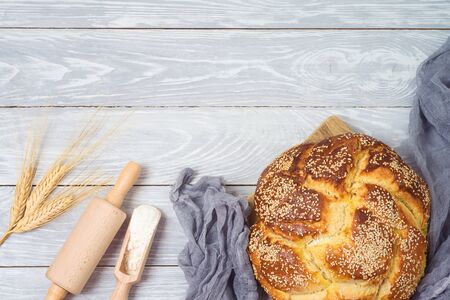 Homemade challah bread on wooden table. Top view from aboveの写真素材
