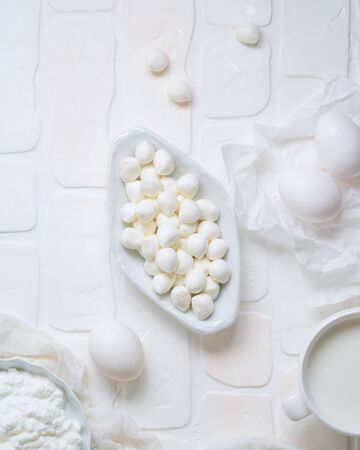 Mozzarella cheese on white background. Top view from aboveの写真素材