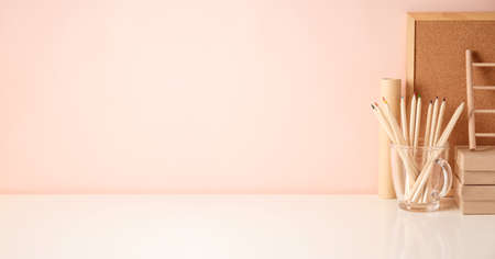 Back to school  background with wooden and cardboard supplies  Stylish home office conceptの写真素材