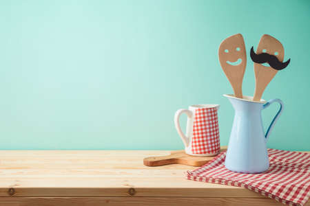 Wooden kitchen counter with kiitchen utensils in jug. Product montage display background or mock upの写真素材