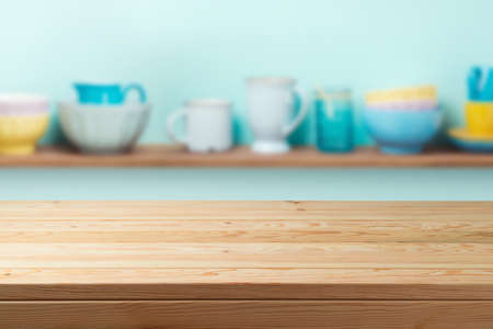 Empty wooden table  over kitchen shelf background.  Interior mock up for design and product display.