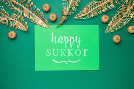 Jewish holiday Sukkot concept with decorations over green background