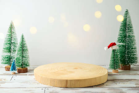 Empty wooden log  on rustic table over festive winter  background.  Christmas and New Year mock up for design and product display.の写真素材