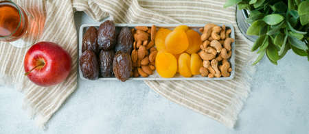 Flat lay composition with dried fruits, wine and nuts. Jewish holiday Tu Bishvat concept. Top view modern background.の写真素材